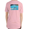 Women’s pink comfortable tshirt with a girl wakesurfing and lakecation graphic.